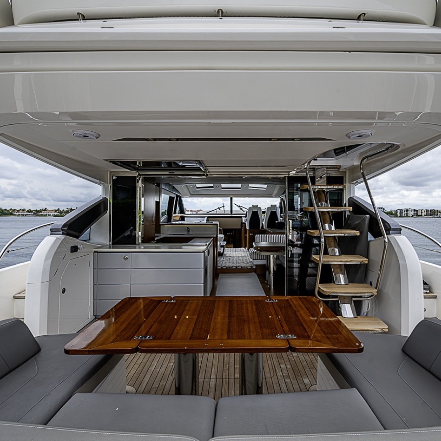 Teak table on the aft deck of a 65-foot yacht