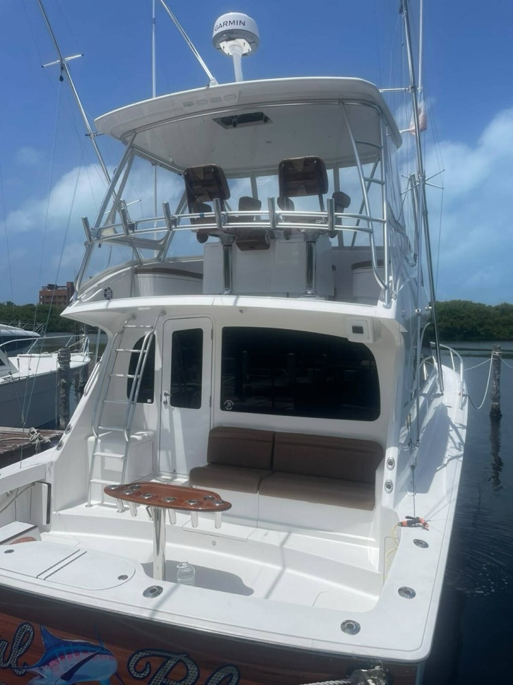 The cockpit and flybridge of a 42-foot sportfisher at the dock