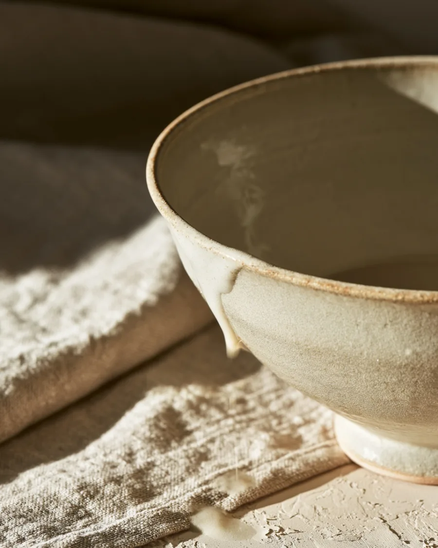 Glaze pooling and breaking over a thrown rim