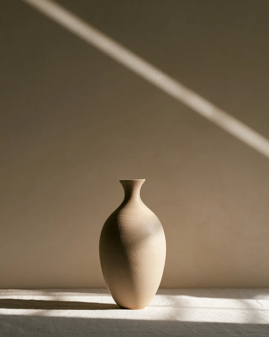 Tall sand-coloured vase with a narrow neck