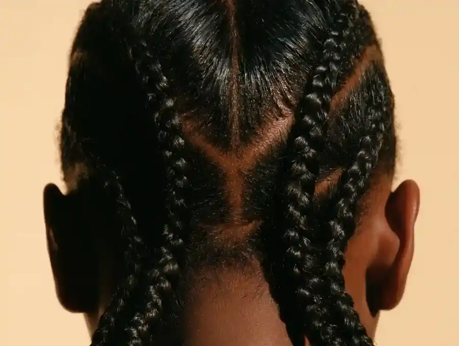 Back of the head with hair flattened into neat cornrows