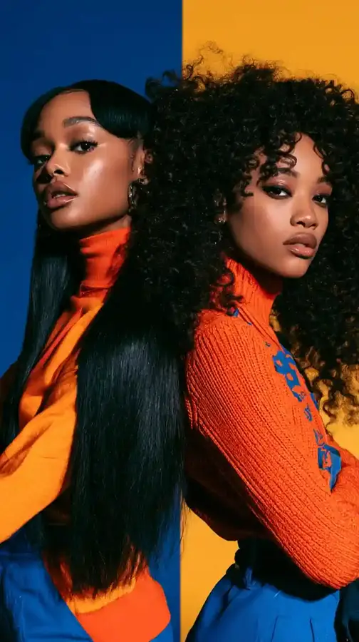 Two models side by side against a split blue and yellow backdrop