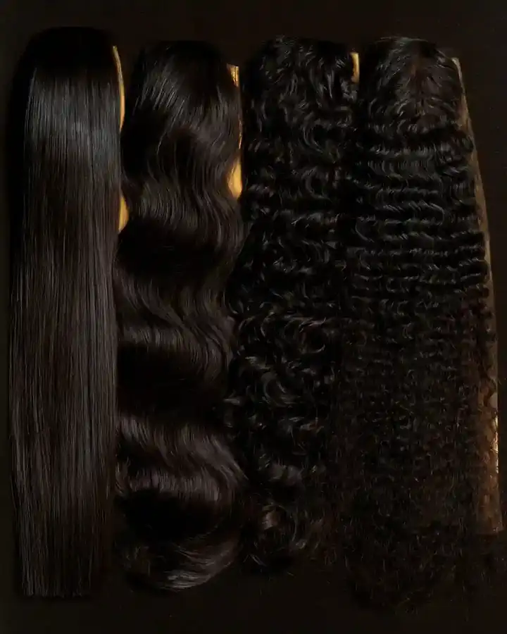 Hair lengths laid side by side on a dark surface, straight through to coiled