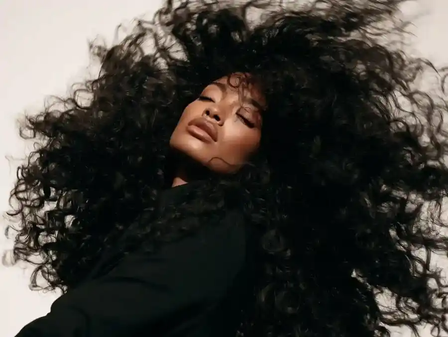 Curly hair being shaken out, mid movement