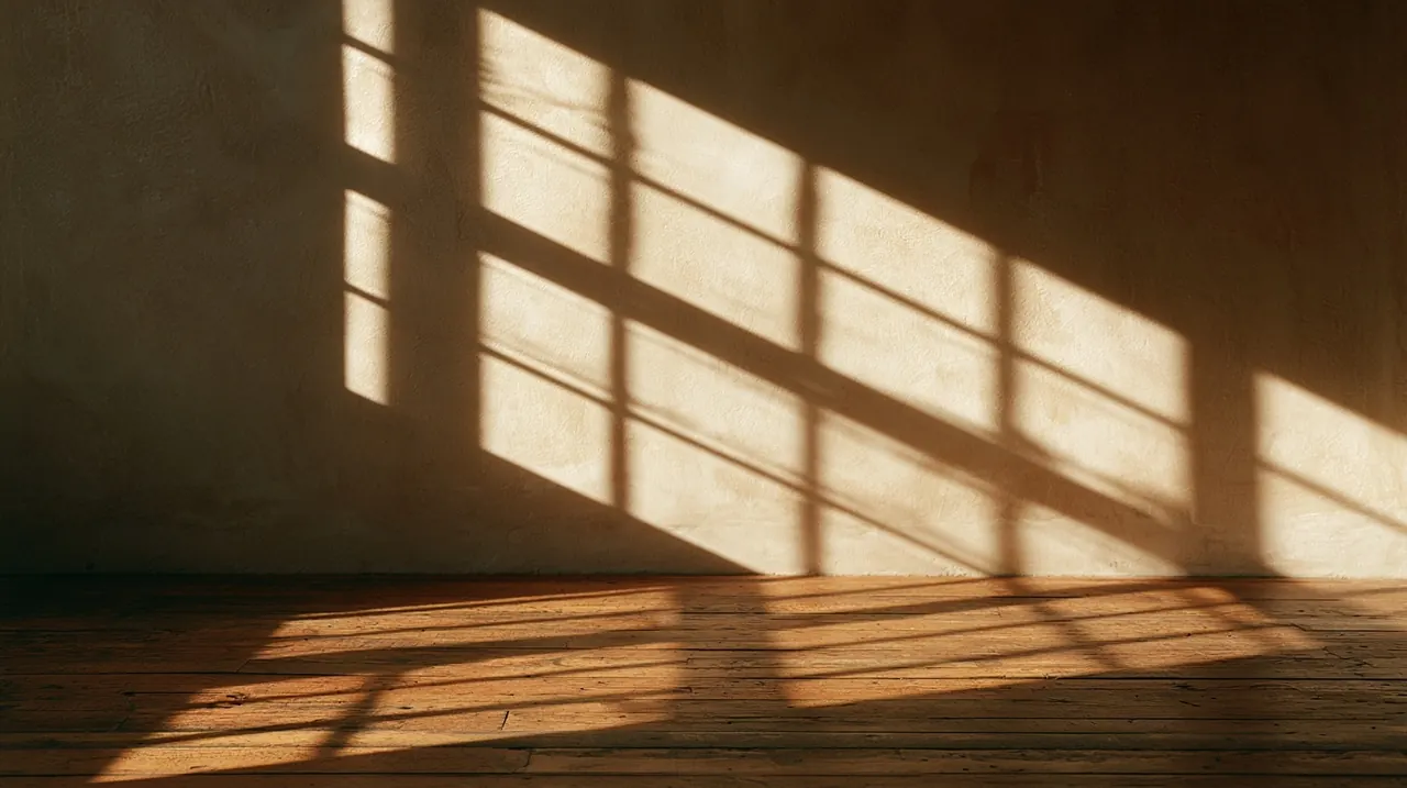 Wide frame, ten o&rsquo;clock light across the wall